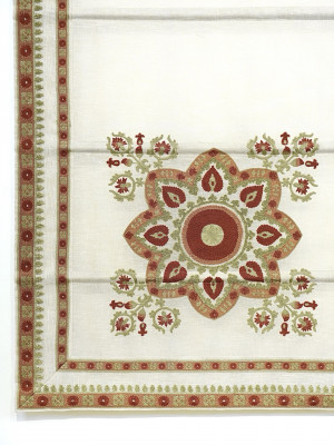 Cream-colored fabric blind with a central floral mandala pattern
