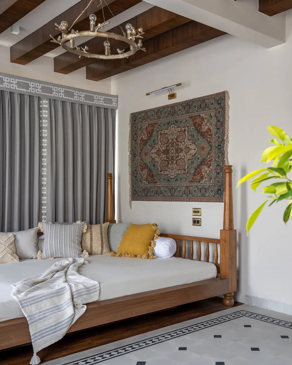 Our Coil curtains frame a convivial daybed, in a modern Indian home designed by Baheti & Associates.